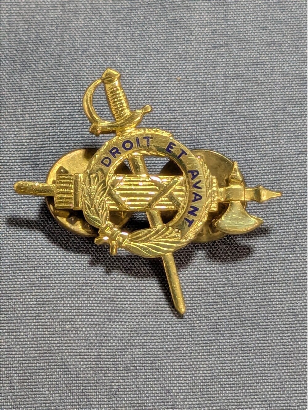 Vintage Military Badge with Swords and Axe Design